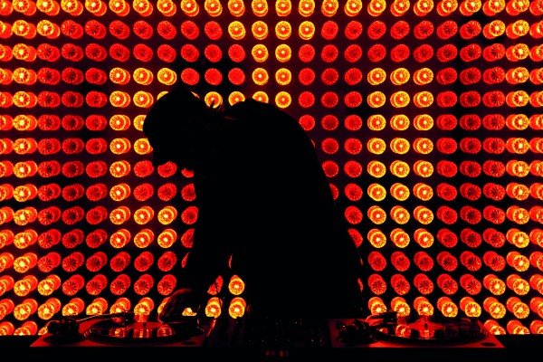 A DJ scratching a record in a nightclub. Image shot 2009. Exact date unknown.
