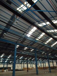 A Cumbrian construction company has been fined after a man was critically injured falling 10m through the roof of an industrial unit.